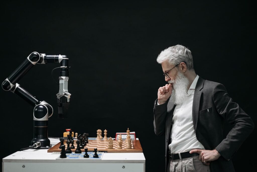 Man playing chess with interactive AI robtic arm